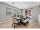 Dining room with a large dining table, chairs, and a bench under bright natural light at 4021 Mountain Trek St, Las Vegas, NV 89129