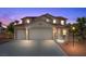 Charming two-story home with a red tile roof, three-car garage, and desert landscaping at 4021 Mountain Trek St, Las Vegas, NV 89129