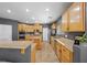 Open kitchen featuring stainless appliances, center island, tile flooring, and wood cabinets at 4021 Mountain Trek St, Las Vegas, NV 89129