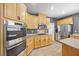 Modern kitchen featuring stainless steel appliances, granite countertops, and lots of cabinets at 4021 Mountain Trek St, Las Vegas, NV 89129