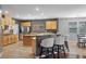Large, open kitchen with an island, breakfast bar, and stainless steel appliances at 4021 Mountain Trek St, Las Vegas, NV 89129