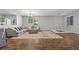 Spacious living room with hardwood floors, a large sofa, and a climbing structure at 4021 Mountain Trek St, Las Vegas, NV 89129
