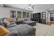 Comfortable living room with a large sectional sofa, TV, and entertainment center at 4021 Mountain Trek St, Las Vegas, NV 89129