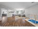 Open living space with hardwood floors, a sofa, and a play area at 4021 Mountain Trek St, Las Vegas, NV 89129