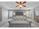 Spacious bedroom with carpet, a ceiling fan, and a seating area at 4021 Mountain Trek St, Las Vegas, NV 89129