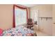 Cozy bedroom with an office chair, mirrored closet and bright window at 4027 Maple Hill Rd, Las Vegas, NV 89115