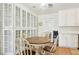 Cozy dining area featuring a round table, four chairs, and built-in cabinetry at 4027 Maple Hill Rd, Las Vegas, NV 89115