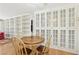 Bright dining area featuring built-in glass cabinets and a wooden round table at 4027 Maple Hill Rd, Las Vegas, NV 89115