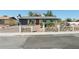 Charming single-story home with brick driveway, stone accents, and vibrant front yard landscaping at 4027 Maple Hill Rd, Las Vegas, NV 89115
