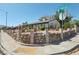 View of a single-story home with brick and stone accents with manicured landscaping at corner at 4027 Maple Hill Rd, Las Vegas, NV 89115