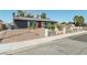 A single-story home with brick driveway and stone-lined landscaping at 4027 Maple Hill Rd, Las Vegas, NV 89115