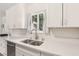Kitchen featuring white quartz counters, a stainless steel sink, and white cabinetry at 4027 Maple Hill Rd, Las Vegas, NV 89115