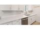 Modern kitchen with white quartz counters, stainless steel appliances, and white cabinets at 4027 Maple Hill Rd, Las Vegas, NV 89115
