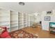 Open living space with built-in bookshelves and views of the dining area at 4027 Maple Hill Rd, Las Vegas, NV 89115