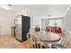 Open concept living space with a round table and a red sofa at 4027 Maple Hill Rd, Las Vegas, NV 89115