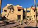 Charming two-story home with red tile roofing, desert landscaping, and a secure gated entrance at 4140 Gannet Cir # 251, Las Vegas, NV 89103
