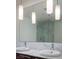 Modern bathroom featuring double sinks, marble countertops, and a glass-enclosed shower at 4471 Dean Martin Dr # 2406, Las Vegas, NV 89103