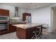 Open kitchen features a breakfast bar, granite countertops, and stainless steel appliances at 4471 Dean Martin Dr # 2406, Las Vegas, NV 89103