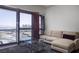 Comfortable living room with ample natural light and a large open window at 4471 Dean Martin Dr # 2406, Las Vegas, NV 89103
