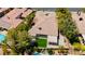 Aerial view of home with lush landscaping, pool, putting green and desert landscape at 4493 Rometta Ave, Las Vegas, NV 89141