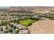 Las Vegas community aerial view with desert landscaping, green space, and single-Gathering homes in a neighborhood at 4493 Rometta Ave, Las Vegas, NV 89141