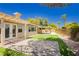 Nicely landscaped backyard with patio, artificial turf, and pergola at 4493 Rometta Ave, Las Vegas, NV 89141