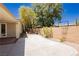 The backyard features a large patio and privacy wall with mature trees for a tranquil outdoor space at 4493 Rometta Ave, Las Vegas, NV 89141