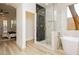 Luxurious bathroom showcasing a modern walk-in shower and a standalone soaking tub at 4493 Rometta Ave, Las Vegas, NV 89141