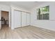 Cozy bedroom with a large window providing ample natural light and closet with mirrored sliding doors at 4493 Rometta Ave, Las Vegas, NV 89141