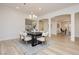 Elegant dining room with modern lighting, arched doorways, and stylish decor at 4493 Rometta Ave, Las Vegas, NV 89141