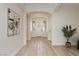 Inviting entryway with wood floors, neutral walls, and an arched doorway at 4493 Rometta Ave, Las Vegas, NV 89141