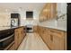 Modern kitchen features stainless steel appliances and sleek cabinetry at 4493 Rometta Ave, Las Vegas, NV 89141