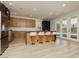 Spacious kitchen featuring stainless steel appliances, a large island with seating, and modern cabinetry at 4493 Rometta Ave, Las Vegas, NV 89141