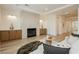 Elegant living room features a modern fireplace, custom cabinets, and hardwood flooring at 4493 Rometta Ave, Las Vegas, NV 89141