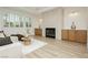 Bright living room featuring a fireplace, built-in cabinets, and modern decor at 4493 Rometta Ave, Las Vegas, NV 89141