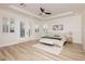 Bright bedroom with a ceiling fan, French doors to the backyard, and stylish decor at 4493 Rometta Ave, Las Vegas, NV 89141
