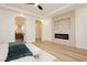 Spacious bedroom has a tiled accent wall with an electric fireplace, doorways to other rooms at 4493 Rometta Ave, Las Vegas, NV 89141