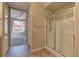 Bathroom view with glass-enclosed shower and tile flooring that leads to another room at 4672 Regalo Bello St, Las Vegas, NV 89135