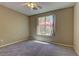 Bedroom with carpeting and a bright window that lets in a lot of natural light at 4672 Regalo Bello St, Las Vegas, NV 89135