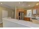 Spacious kitchen featuring stainless steel appliances, wooden cabinetry, and breakfast bar at 4672 Regalo Bello St, Las Vegas, NV 89135