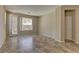 This bright living room has a door to the outside, a window, and beautiful tile flooring at 4672 Regalo Bello St, Las Vegas, NV 89135