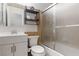 Bathroom with glass enclosed shower, white vanity and shelving at 4775 Woodridge Rd, Las Vegas, NV 89121