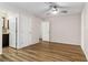 Spacious bedroom boasts wood floors, ceiling fan, and ensuite bath at 4775 Woodridge Rd, Las Vegas, NV 89121