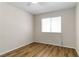 Bedroom offers wood flooring, and a bright window at 4775 Woodridge Rd, Las Vegas, NV 89121