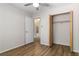 Bedroom features wood floors, closet, and ensuite bathroom at 4775 Woodridge Rd, Las Vegas, NV 89121