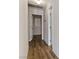 Hallway with wood floors leading to rooms at 4775 Woodridge Rd, Las Vegas, NV 89121