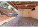 Comfortable patio with unique pavers and relaxing hammock at 4775 Woodridge Rd, Las Vegas, NV 89121