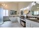 Bathroom with double vanities, soaking tub, modern fixtures, and beautiful decor at 5133 Southern Hills Ln, Las Vegas, NV 89113
