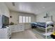 Bright bedroom with neutral paint, plush carpet, shutters, and a fun bunk bed at 5133 Southern Hills Ln, Las Vegas, NV 89113