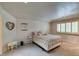 Cozy bedroom with a comfortable bed, plush carpets, and bright shutters for a relaxing atmosphere at 5133 Southern Hills Ln, Las Vegas, NV 89113